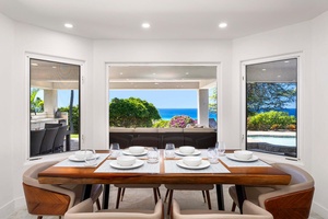 Gather around the six-seater dining table for memorable meals with ocean and garden views.