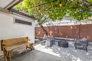 Lounge under the Plumeria trees with this cozy fire pit set up!