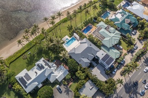 Aerial view highlighting the estate’s prime beachfront location in a peaceful neighborhood.