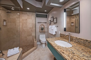 Guest bathroom with single vanity and walk-in shower