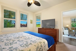 Relax in your peaceful king bedroom with tropical views, modern amenities, and comfortable bedding for restful nights.