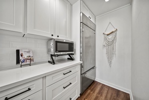 Convenient butler’s pantry and prep area with high-end appliances, offering everything needed for extended family stays or catered events.