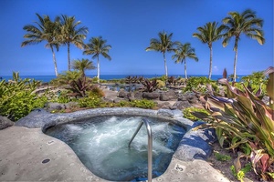 Soak in the oceanfront jacuzzi while sipping on a Mai Tai