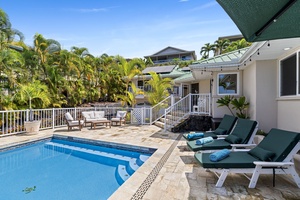 Soak up the sunshine on your private poolside loungers, surrounded by swaying palms in this tropical paradise.