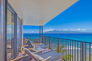 Enjoy breathtaking ocean views from Kaanapali Shores 702’s spacious lanai with comfy lounge chairs.