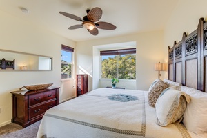 The second bedroom includes its own ensuite, ensuring privacy and comfort for guests with a king bed and lush views.