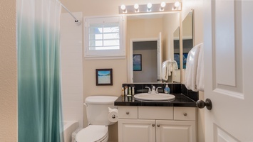 The second guest bathroom vanity and natural lighting.