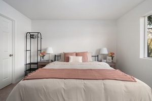 Wake up refreshed in this serene space with cozy linens and soft light—designed for ultimate guest relaxation.