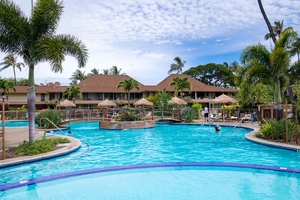 Relax in the pool or under the tiki huts