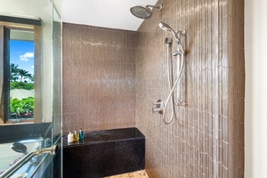 Wash away the day in the sleek walk-in shower with rainfall head.