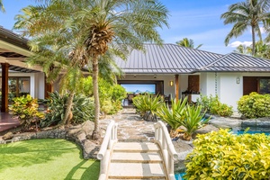 Stone paths connect serene courtyards and luxurious suites in true Hawaiian fashion.