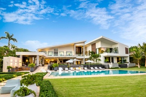 Modern architectural design of this oceanfront villa, complete with expansive outdoor living spaces and infinity pool.