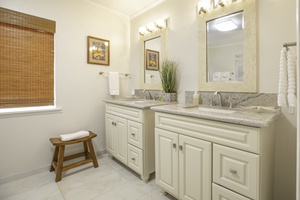 Elegant bathroom featuring dual sinks and plenty of counter space.