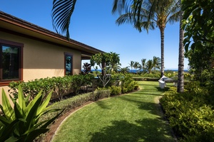 Closer view of side yard off guest bedroom two with hammock and ocean beyond.