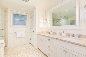 Bathroom with tub and walk-in shower.
