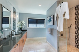 Downstairs primary ensuite bath with wide vanity space in a single sink