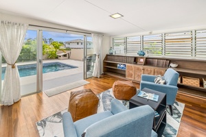 The view from the primary suite lounge looking to the pool.