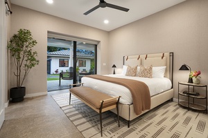 Elegant primary suite retreat with plush king-sized bed and direct garden access.