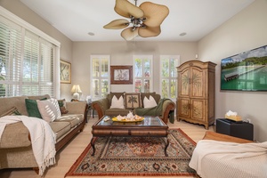 Sink into plush sofas where tropical-themed décor and warm lighting create your perfect retreat for evening relaxation.