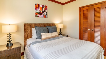 The second guest bedroom with a queen bed and TV.