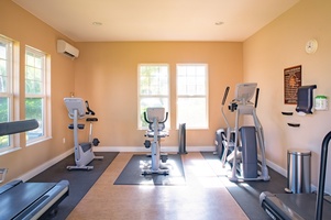 Another fitness space offers cardio machines and natural lighting—ideal for morning workouts with peaceful surroundings.