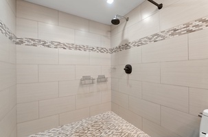 Stylish bathroom featuring elegant fixtures and a refreshing walk-in shower.