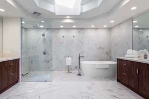 Spacious ensuite with a walk-in shower and soaking tub—your private spa at home.