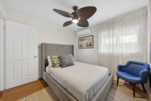 Modern guest suite with a neutral palette, stylish decor, and soft lighting for ultimate relaxation.