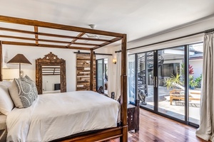 This bedroom includes an ensuite bath as well as a full-size washer and dryer.