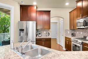 Enjoy a chef-ready kitchen with granite countertops, stainless steel appliances, and everything you need to cook at home.
