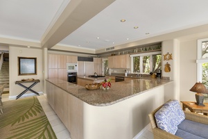 Open-concept kitchen with bar seating, ideal for entertaining or casual breakfasts.