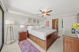 Wake up to panoramic views of the Pacific from a spacious, well-appointed primary bedroom with a king-sized bed.