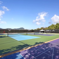 Pickleball courts at Poipu Beach Athletic Club offer a fun and engaging activity for players of all skill levels.