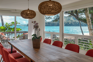 Gather around the table in comfort — seats 10 with views of mountains and sea through every window.