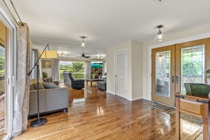 Step into a light-filled entry that flows into the living space, perfect for gathering after beach days.