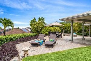 Sunbathe in comfort with ocean breezes on cushioned loungers by the poolside retreat.