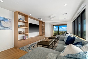 Sink into this stylish living space where your favorite shows come alive on the large TV with breathtaking views from every window.