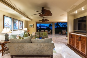 Evening glow over the great room flowing seamlessly to the covered lanai.
