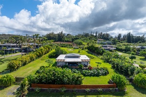 Admire the expansive grounds with manicured landscaping and a private hillside position.