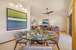 Enjoy meals at the chic glass dining table in Kapalua Ridge 2321, perfect for sharing food and conversation.