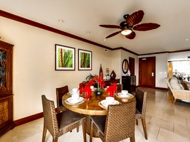 The dining area with framed art and tasteful decor.