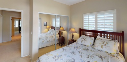 The second guest bedroom with a queen size bed.