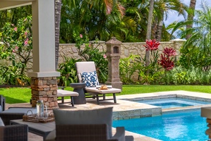 Relax poolside surrounded by lush tropical gardens, vibrant blooms, and swaying palms—your private oasis awaits for sun-soaked afternoons and peaceful moments.