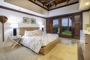 Drift off in your peaceful bedroom sanctuary with natural textures and tropical garden views through sliding doors.