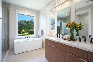 Primary bathroom with soaking tub and outdoor lava rock shower