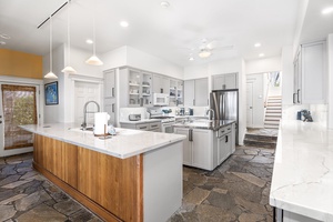 Gas cooktop and deep counters provide professional-grade function for inspired cooking.