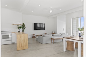 A large smart TV in the living area sets the scene for cozy movie nights.