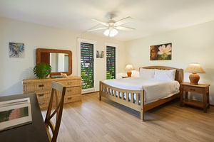 Bright and airy bedroom that has a king bed.