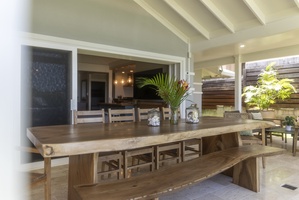 Long dining table for family-style meals after a beach day.