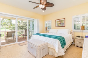 Enjoy the breeze and natural light in this peaceful upstairs retreat with ceiling fan and private lanai access.